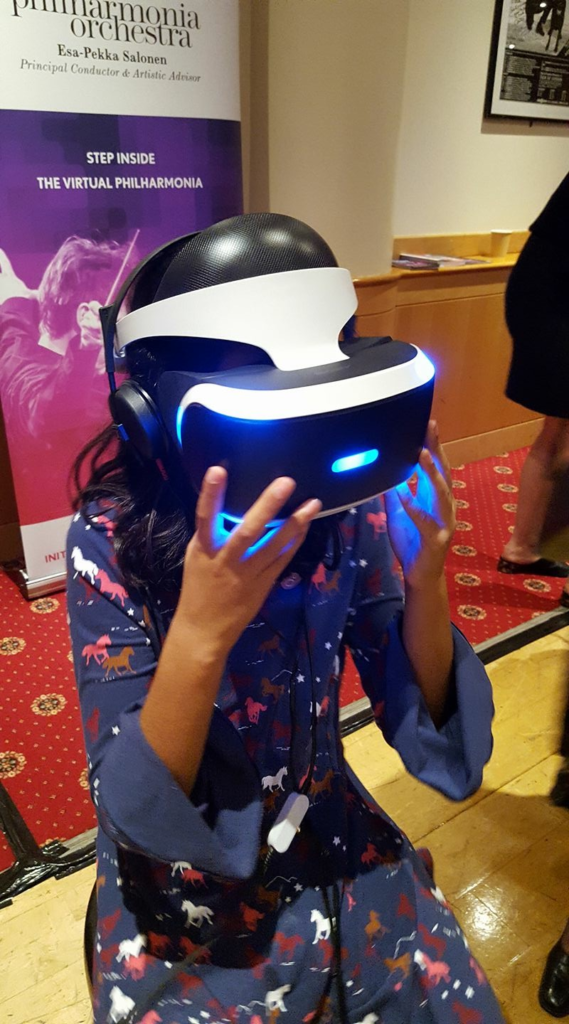 Roxanna experiencing virtual reality at The Philharmonia Guest List performance